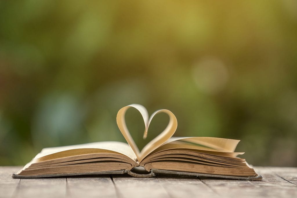 open book with centre pages folded into shape of heart