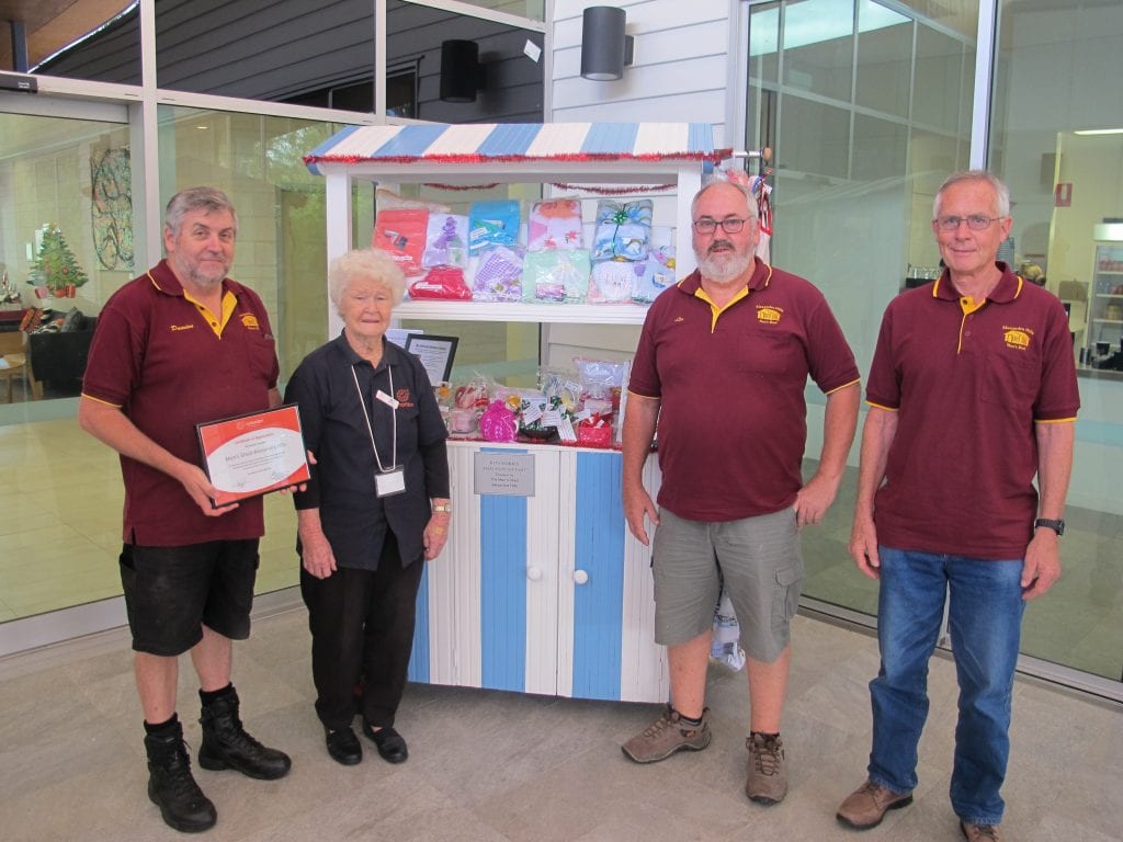 Rita Morris, one of Myhorizon's founders with her craft 'Mary Poppins' cart, kindly donated by members of Alexandra Hills Men's Shed who are accepting a certificate of appreciation from Myhorizon after a morning tea at the Bush Pantry cafe.